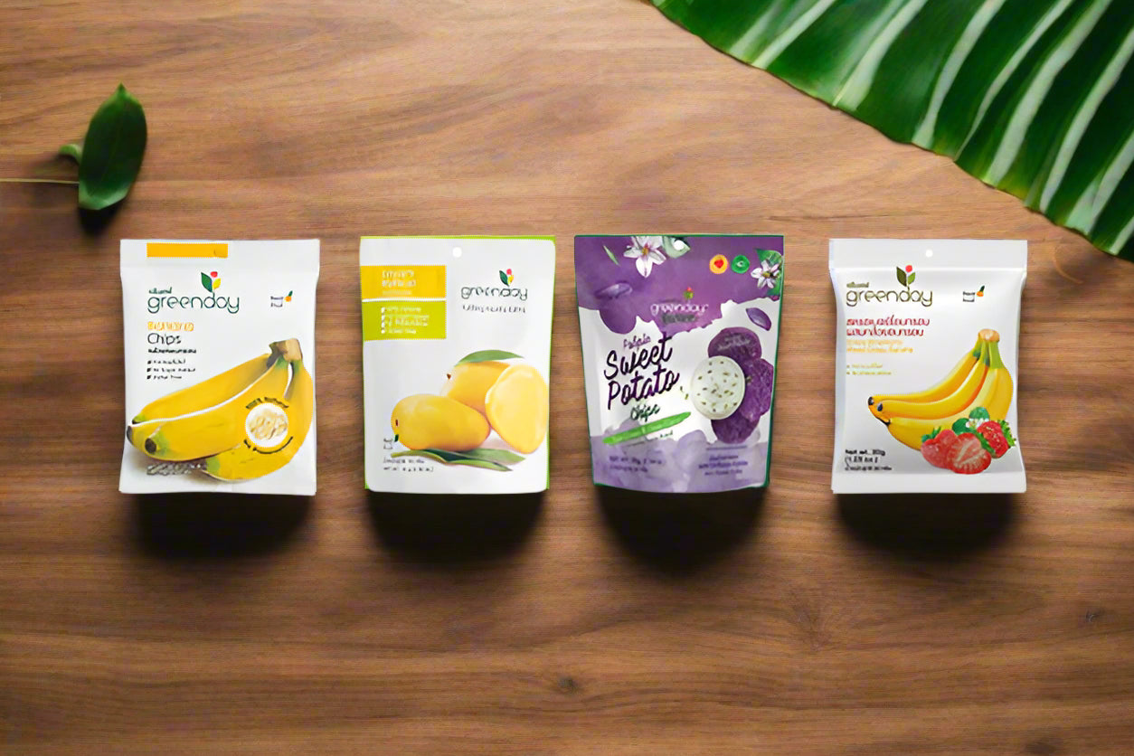 A variety of GREENDAY potato chip bags, featuring different flavors such as banana, mango, and strawberry, against a white background.